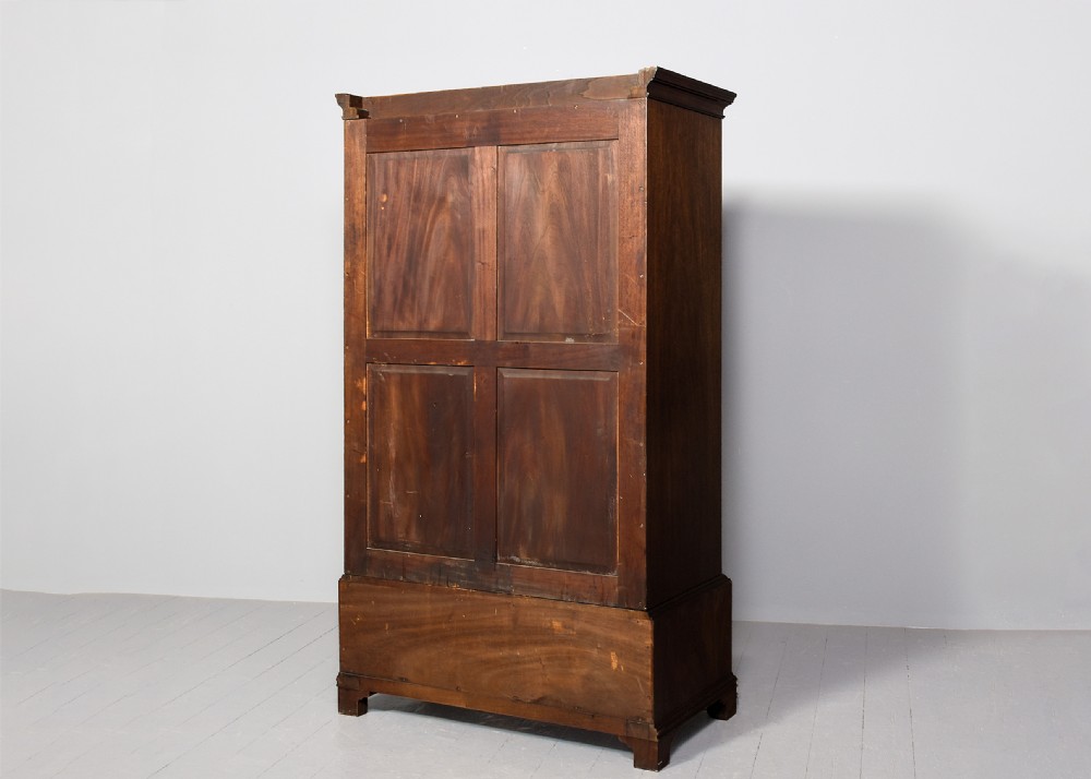 Quality Whytock and Reid neat-sized, two-door mahogany wardrobe with sycamore and figured walnut panelled doors View VIII