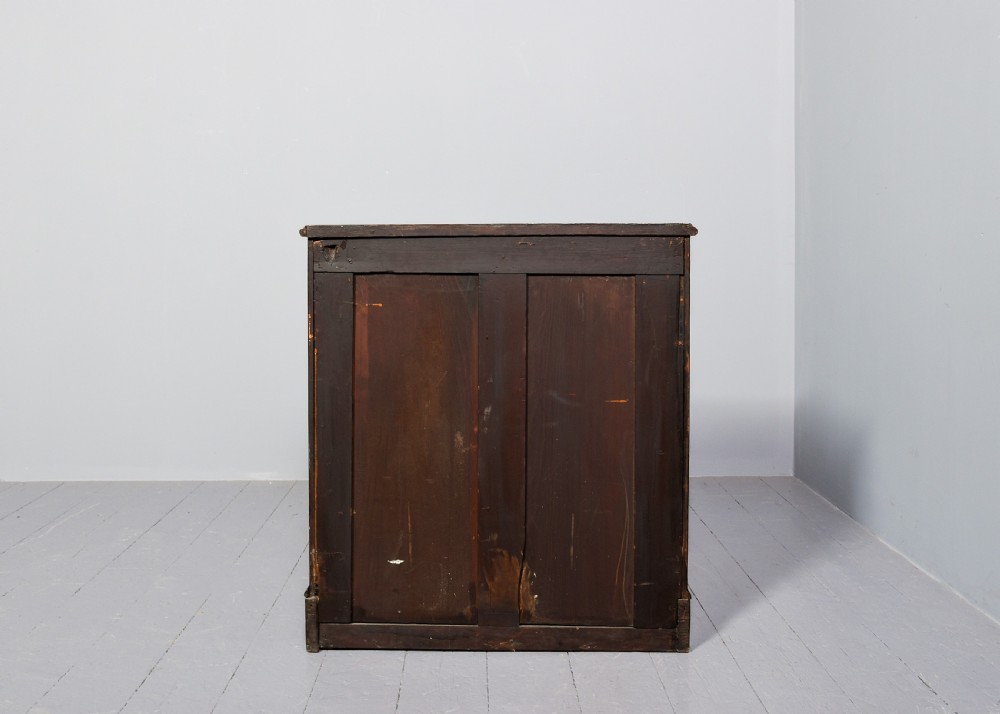A George II style warm brown figured walnut kneehole dressing chest with brass drop handles, a pull-out slide, and a rectangular dressing mirror. View VII