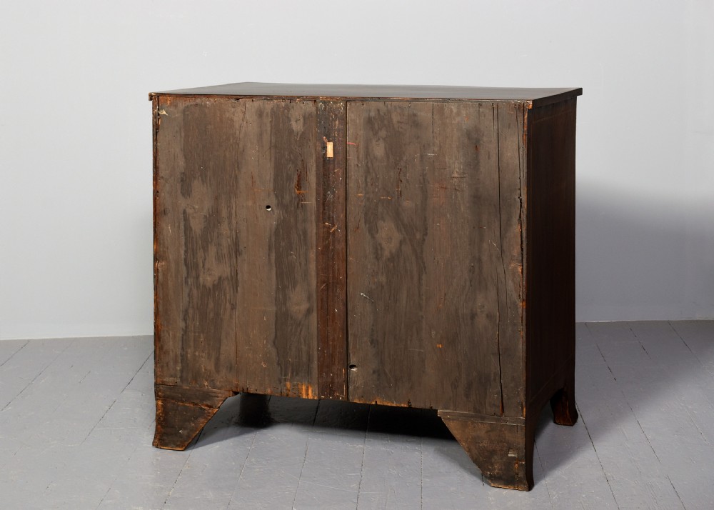 A George III style serpentine front chest of drawers featuring satinwood and floral marquetry inlay with brass ring handles. View VIII