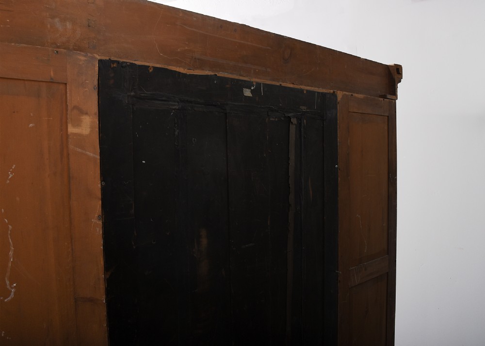A George IV flame mahogany four-door wardrobe with a breakfront profile and moulded cornice. View XV