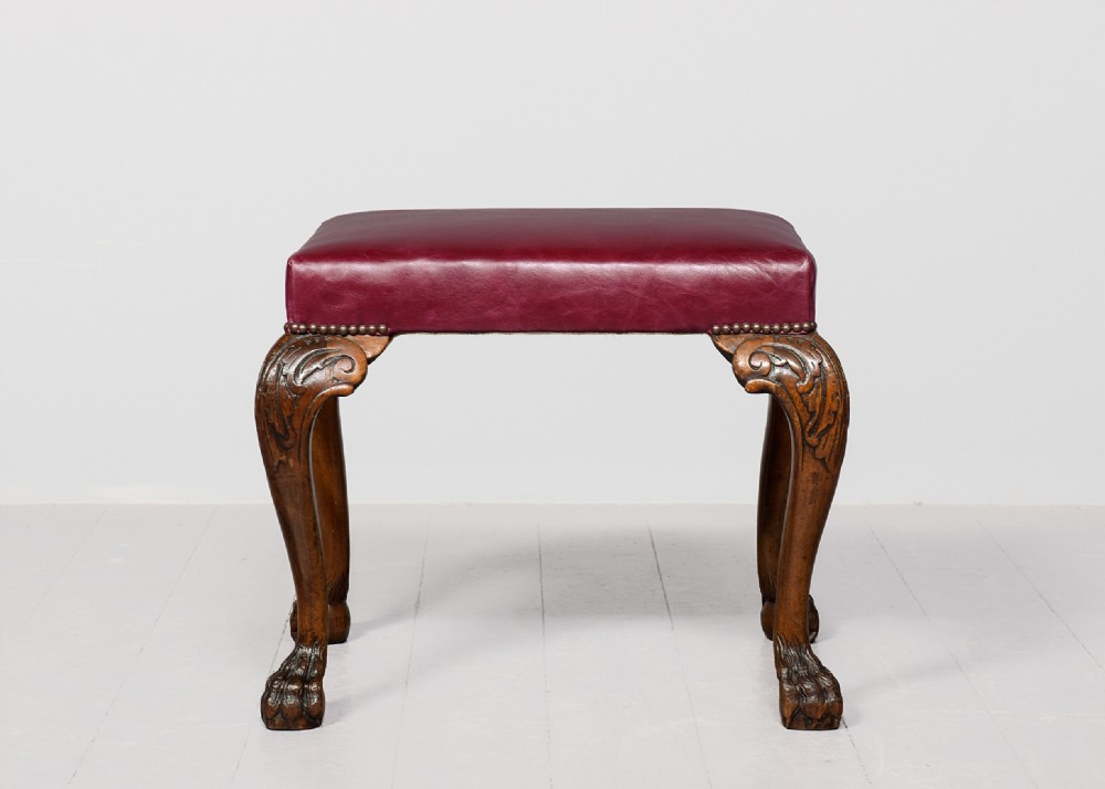 George III style rectangular stool upholstered in a quality burgundy hide with brass studding View VI