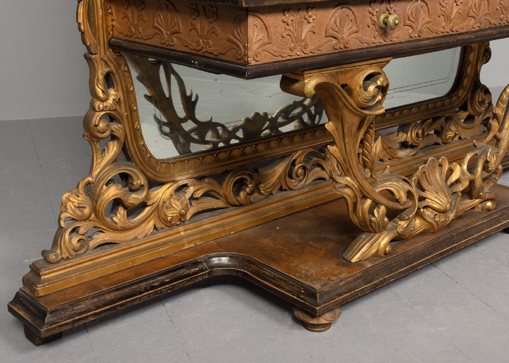 An Italian carved giltwood console table featuring a green marble top and an integrated tall rectangular mirror frame. View III