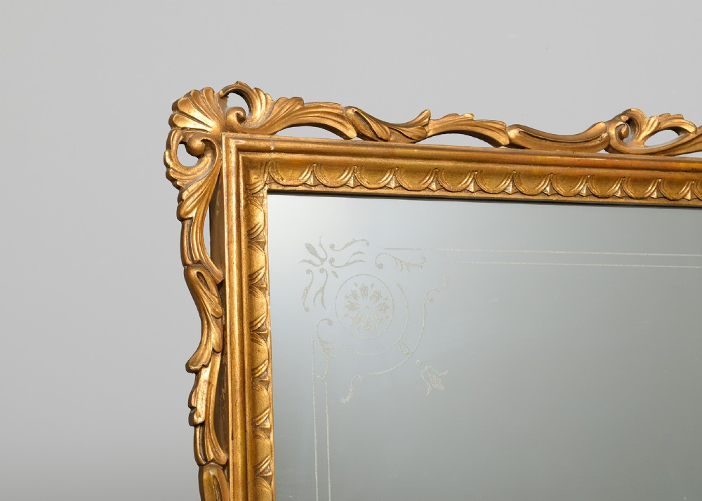 An Italian carved giltwood console table featuring a green marble top and an integrated tall rectangular mirror frame. View IV