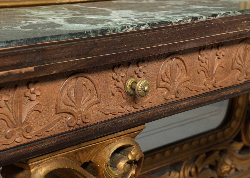 An Italian carved giltwood console table featuring a green marble top and an integrated tall rectangular mirror frame. View VI