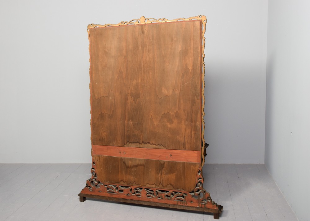 An Italian carved giltwood console table featuring a green marble top and an integrated tall rectangular mirror frame. View X