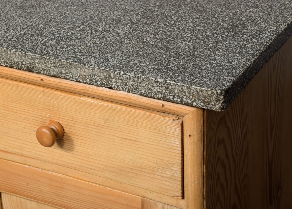 A pair of natural pine bedside cabinets with grey marble tops, single drawers, and diamond carved door panels on turned feet. View VI