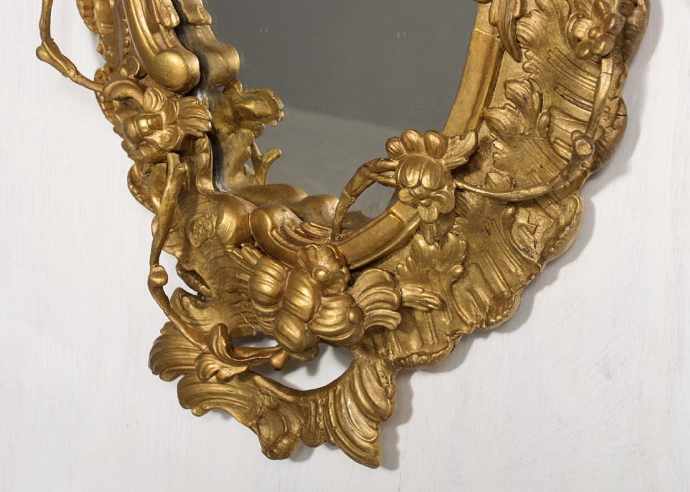An ornate carved gilded frame featuring Rococo scrollwork, acanthus leaves, integrated candle branches, and two mirror sections. View III
