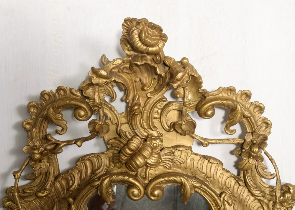 An ornate carved gilded frame featuring Rococo scrollwork, acanthus leaves, integrated candle branches, and two mirror sections. View VI