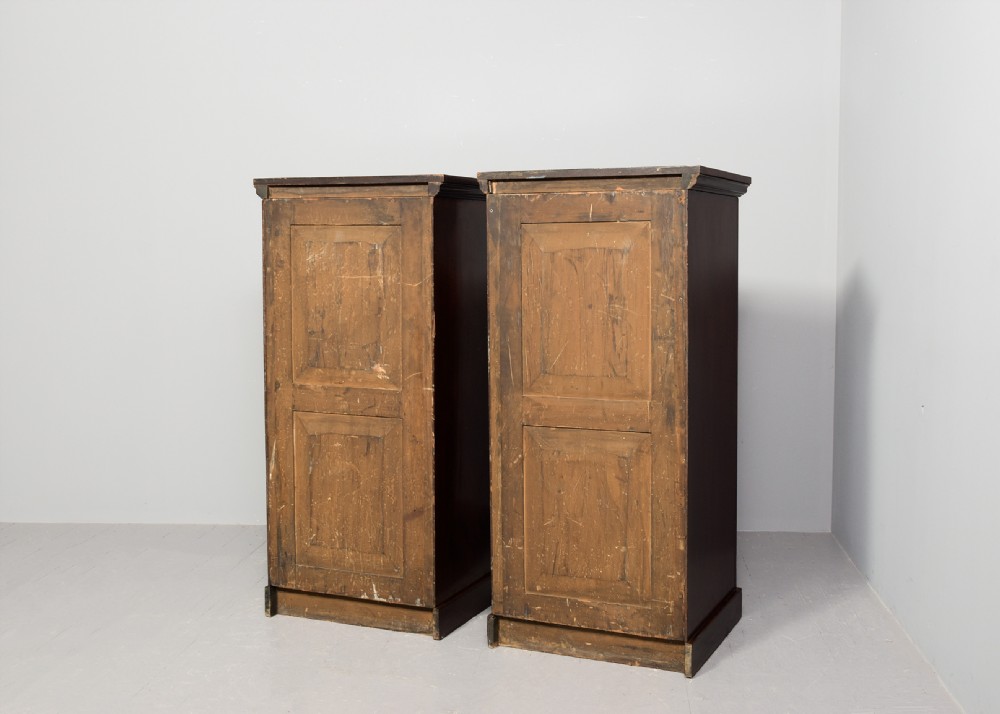 A pair of tall Victorian mahogany Wellington chests, each featuring six graduated drawers with brass handles and side locking stiles set on a plinth base. View IX