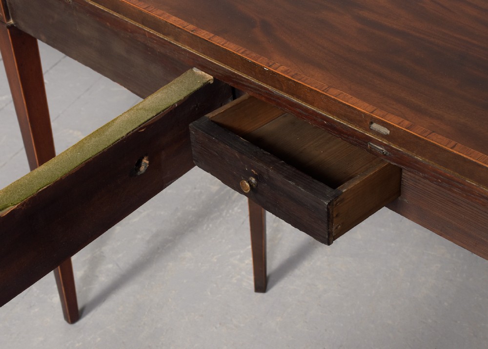 A George III semi-circular mahogany card table with satinwood inlay and square tapered legs. View VIII