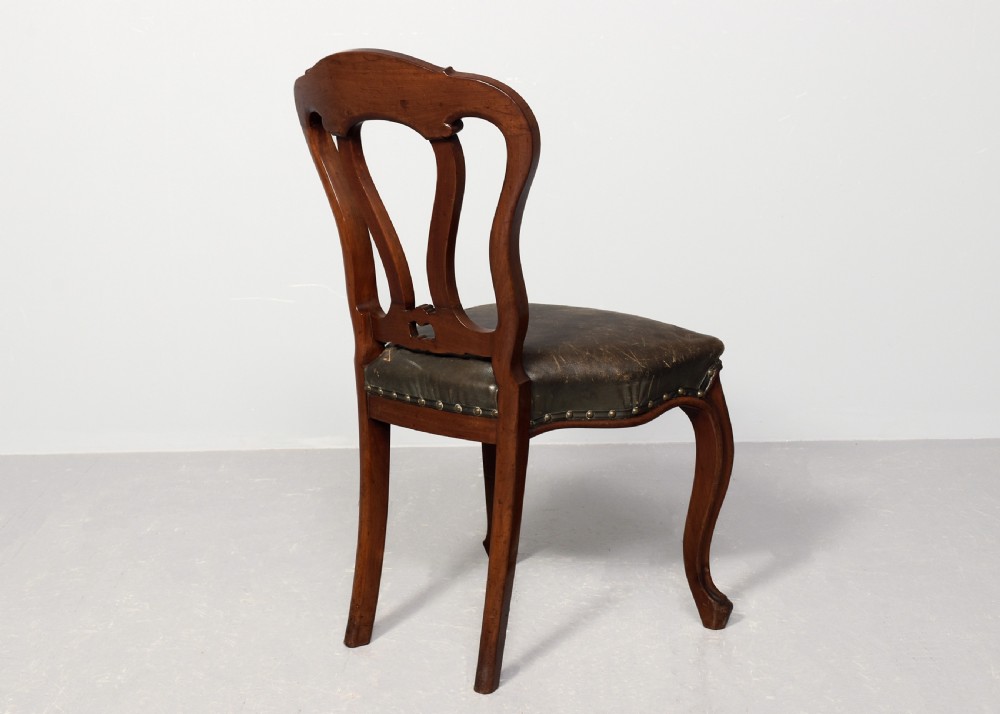 A set of eight Victorian mahogany dining chairs featuring padded leather backs, brass stud detailing, and carved cabriole legs. View XIII