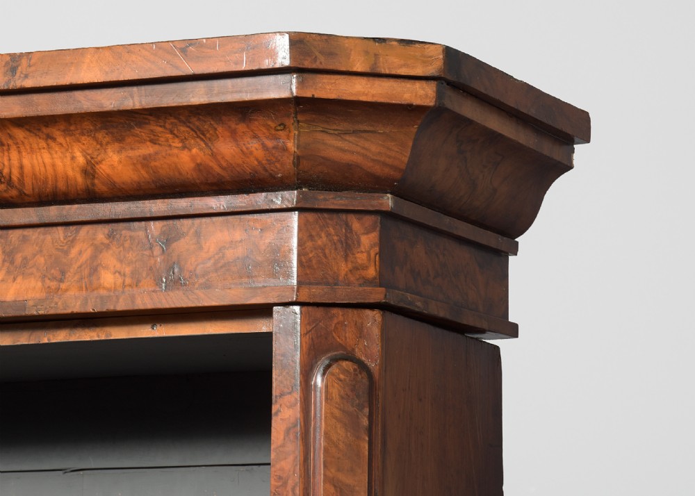 A large three-section Victorian open bookcase made from burr walnut with a breakfront centre section, adjustable shelves, and a plinth base. View III