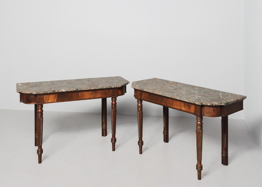 A pair of William IV mahogany break-front hall tables featuring grey marble tops and spiral-turned legs. View II