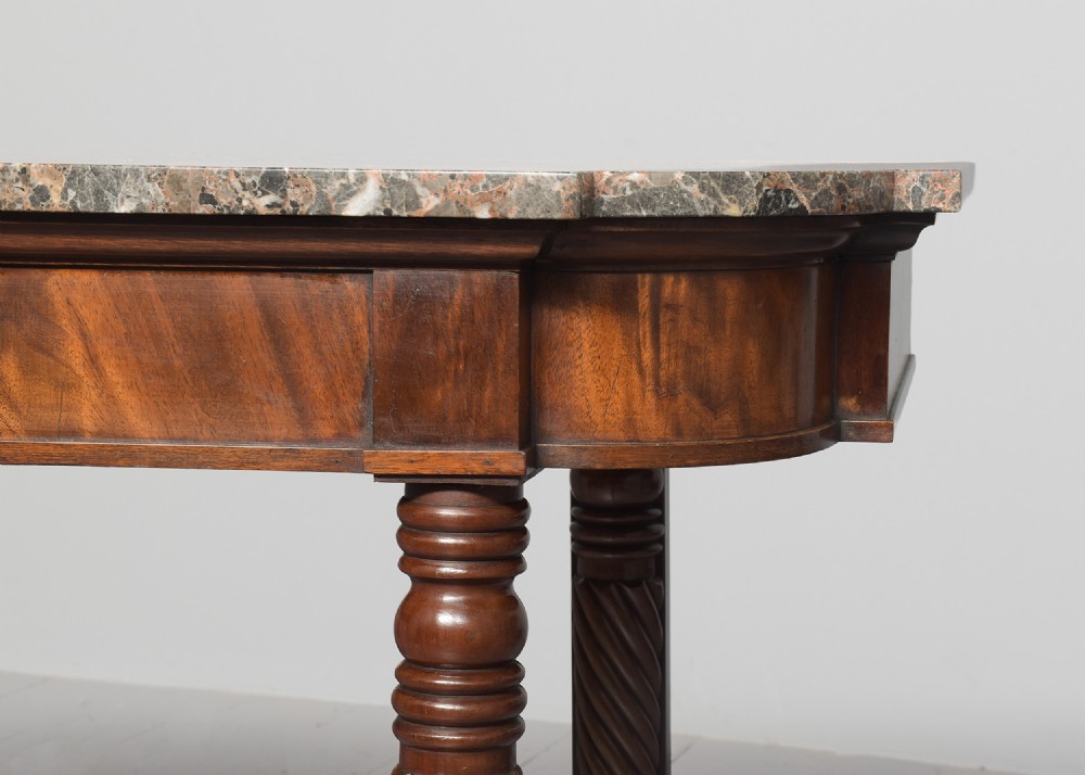 A pair of William IV mahogany break-front hall tables featuring grey marble tops and spiral-turned legs. View III