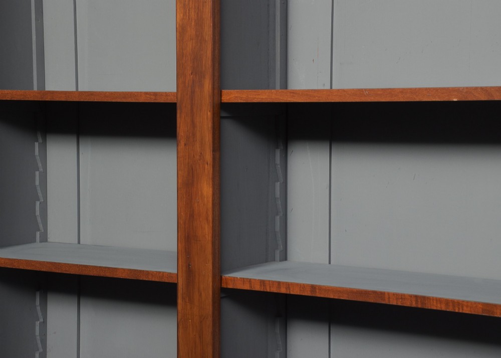 A large three-section mahogany open bookcase featuring adjustable shelves and fine inlay detailing along the top cornice. View II