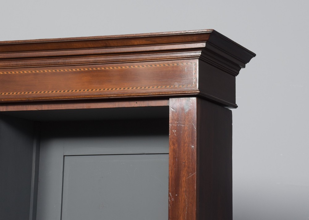 A large three-section mahogany open bookcase featuring adjustable shelves and fine inlay detailing along the top cornice. View IV