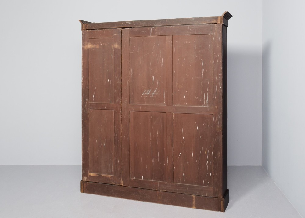 A large three-section mahogany open bookcase featuring adjustable shelves and fine inlay detailing along the top cornice. View VI