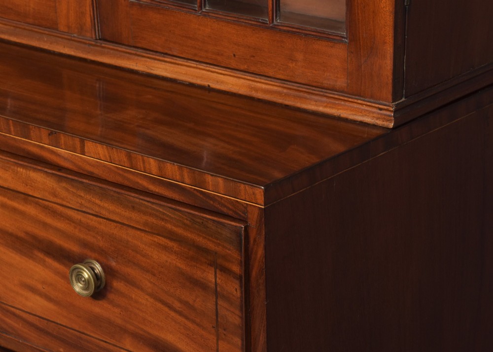 A late eighteenth-century George III mahogany secretaire bookcase featuring an upper glazed cabinet and a lower chest of drawers on bracket feet. View VIII