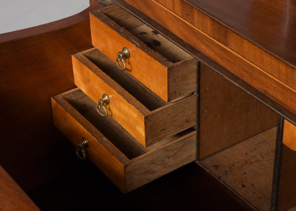 A late eighteenth-century George III mahogany secretaire bookcase featuring an upper glazed cabinet and a lower chest of drawers on bracket feet. View XI