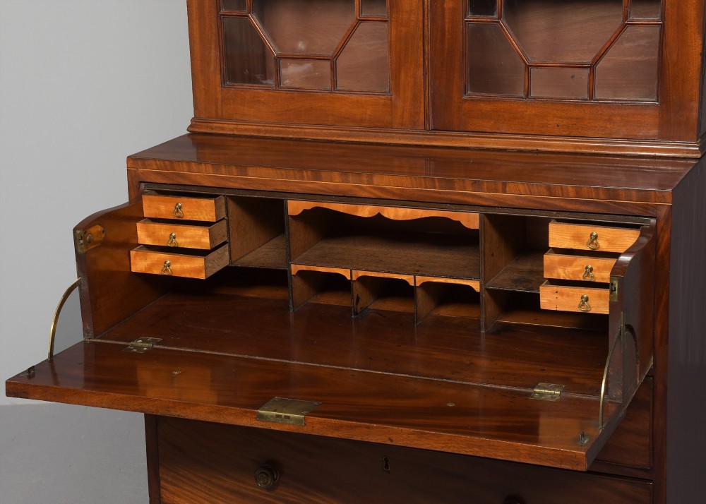 A late eighteenth-century George III mahogany secretaire bookcase featuring an upper glazed cabinet and a lower chest of drawers on bracket feet. View XII