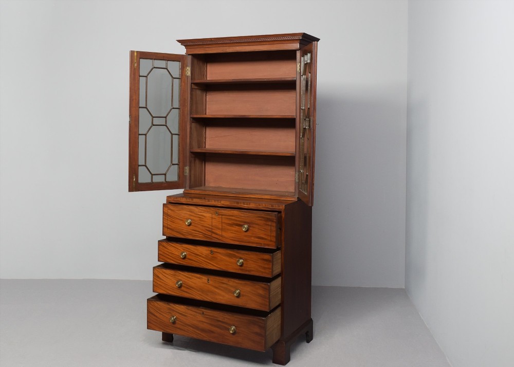 A late eighteenth-century George III mahogany secretaire bookcase featuring an upper glazed cabinet and a lower chest of drawers on bracket feet. View XV
