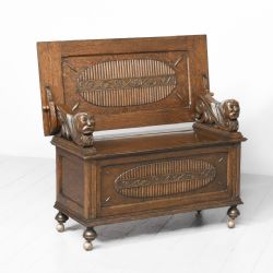 CARVED OAK MONKS BENCH
