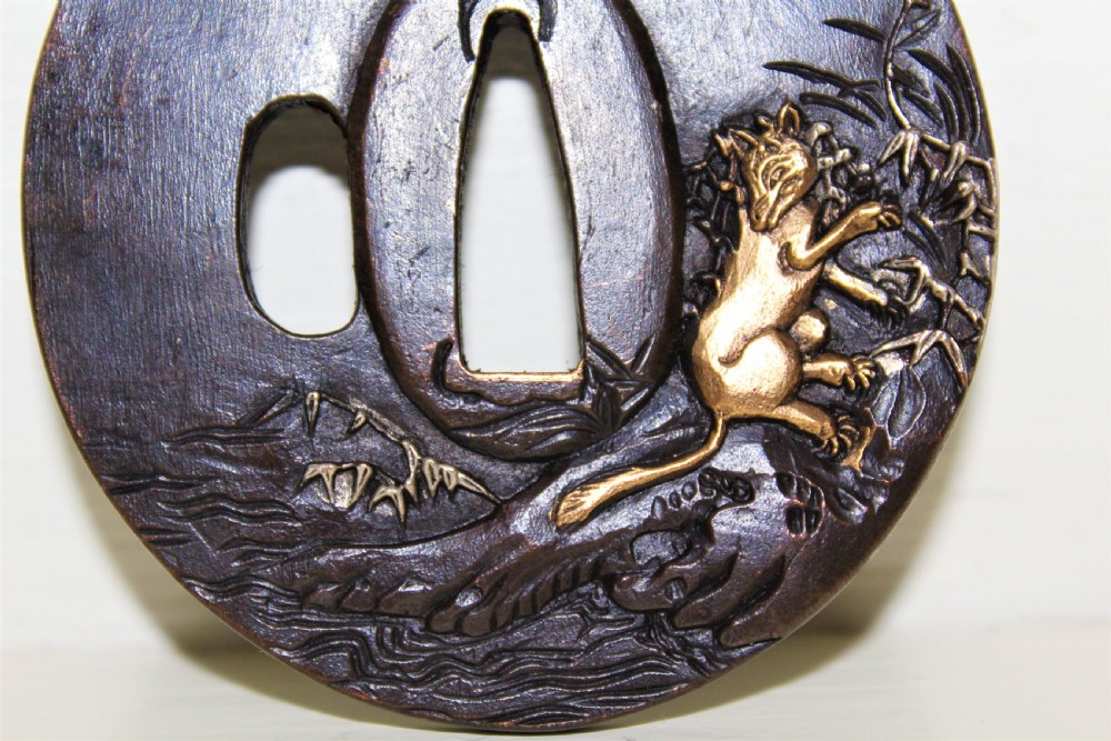 A fine quality Japanese bronze Tsuba overlaid with gold and silver Circa 1880 View II
