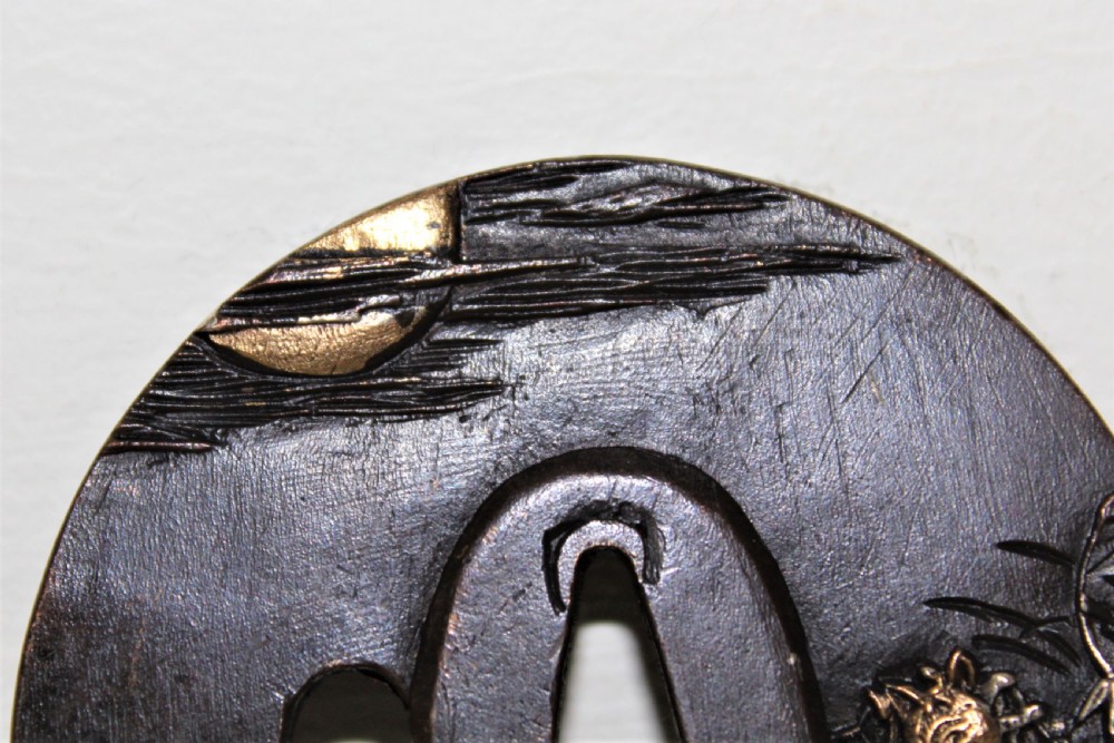 A fine quality Japanese bronze Tsuba overlaid with gold and silver Circa 1880 View III