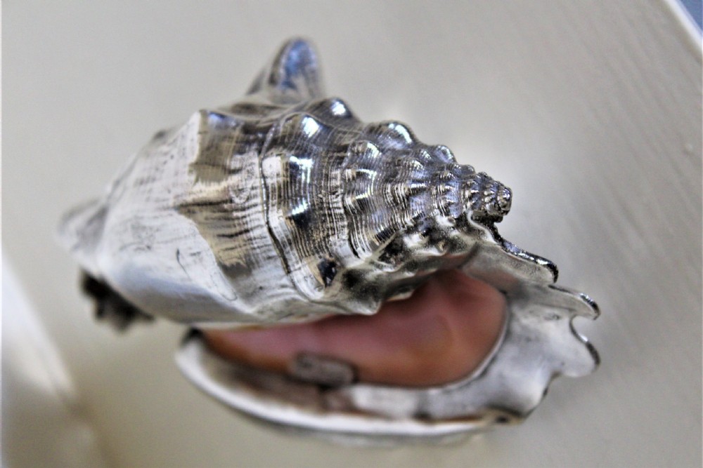 A very decorative conch shell skilfully hand covered in a sheath of heavy gauge silver and signed  View II
