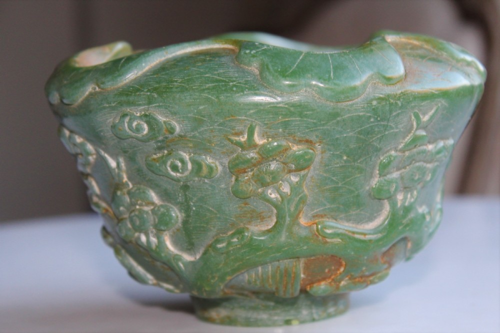 A very attractive Chinese green jade bowl with decoration of cherry blossom and birds  View II