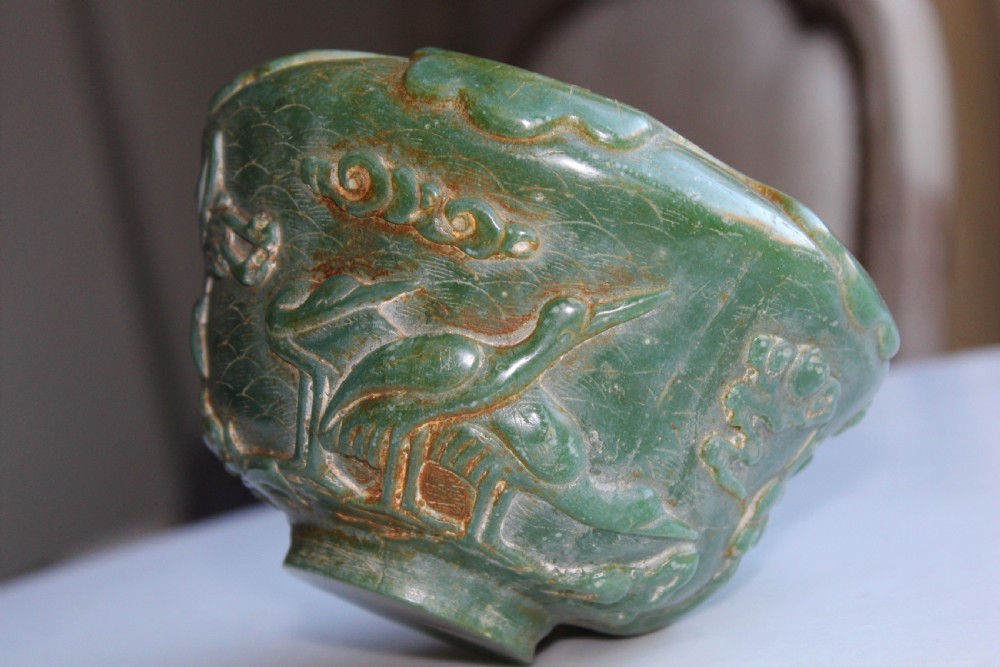 A very attractive Chinese green jade bowl with decoration of cherry blossom and birds  View III