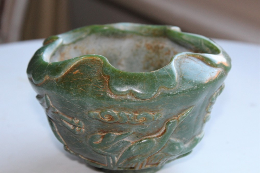 A very attractive Chinese green jade bowl with decoration of cherry blossom and birds  View V