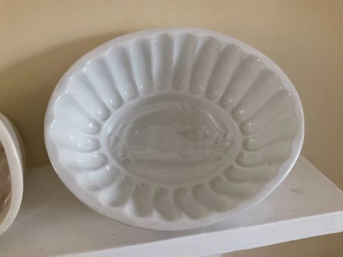 FOUR MIDNINETEENTH CENTURY EARTHENWARE JELLY MOULDS A GRAPES GRAPEVINE MOULD A WILD BOAR MOULD TWO WEDGWOOD FLORAL MOULDS - ADDITIONAL PHOTO 1