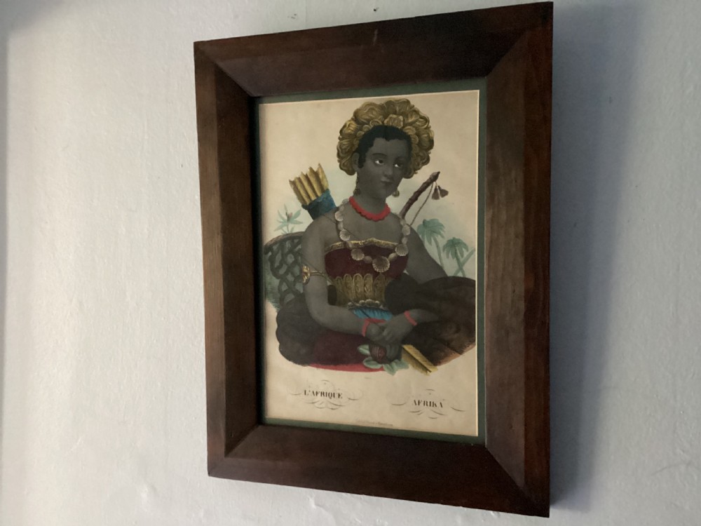 A framed nineteenth-century colour lithograph titled LAfrique depicting an allegorical female figure, set within a wide dark wood frame. View II