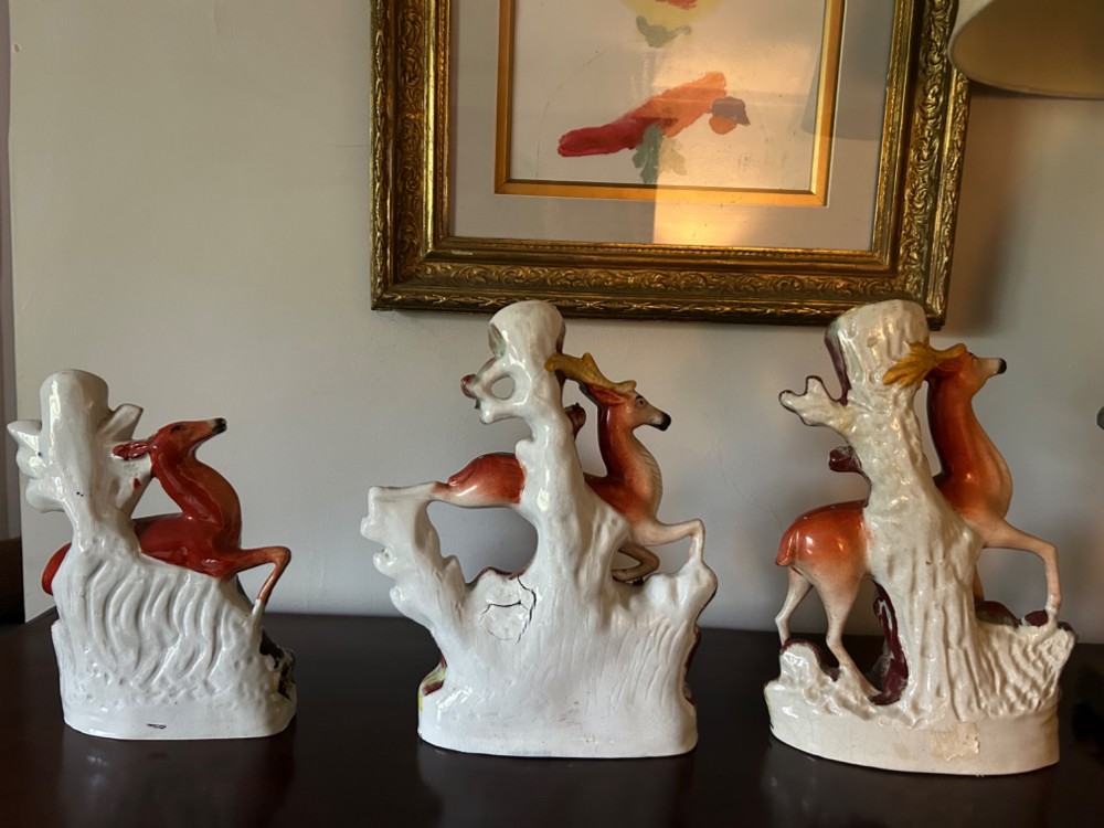 Three 19th-century Staffordshire earthenware spill vases moulded in the form of deer, featuring hand-painted enamels on tree-trunk bases. View II