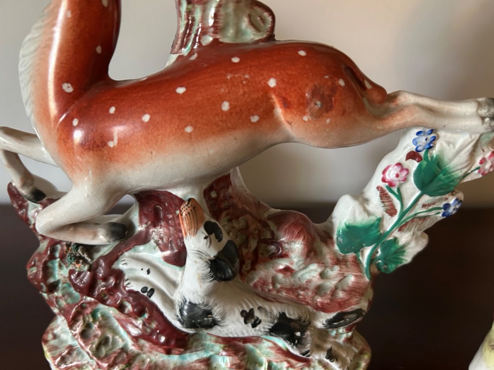 Three 19th-century Staffordshire earthenware spill vases moulded in the form of deer, featuring hand-painted enamels on tree-trunk bases. View IV