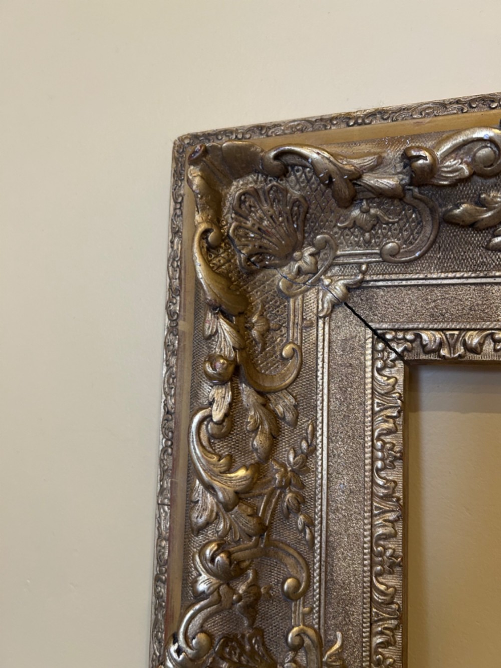 A rectangular 19th-century Rococo Revival style frame with intricate gilded floral, shell, and scrollwork gesso mouldings. View III