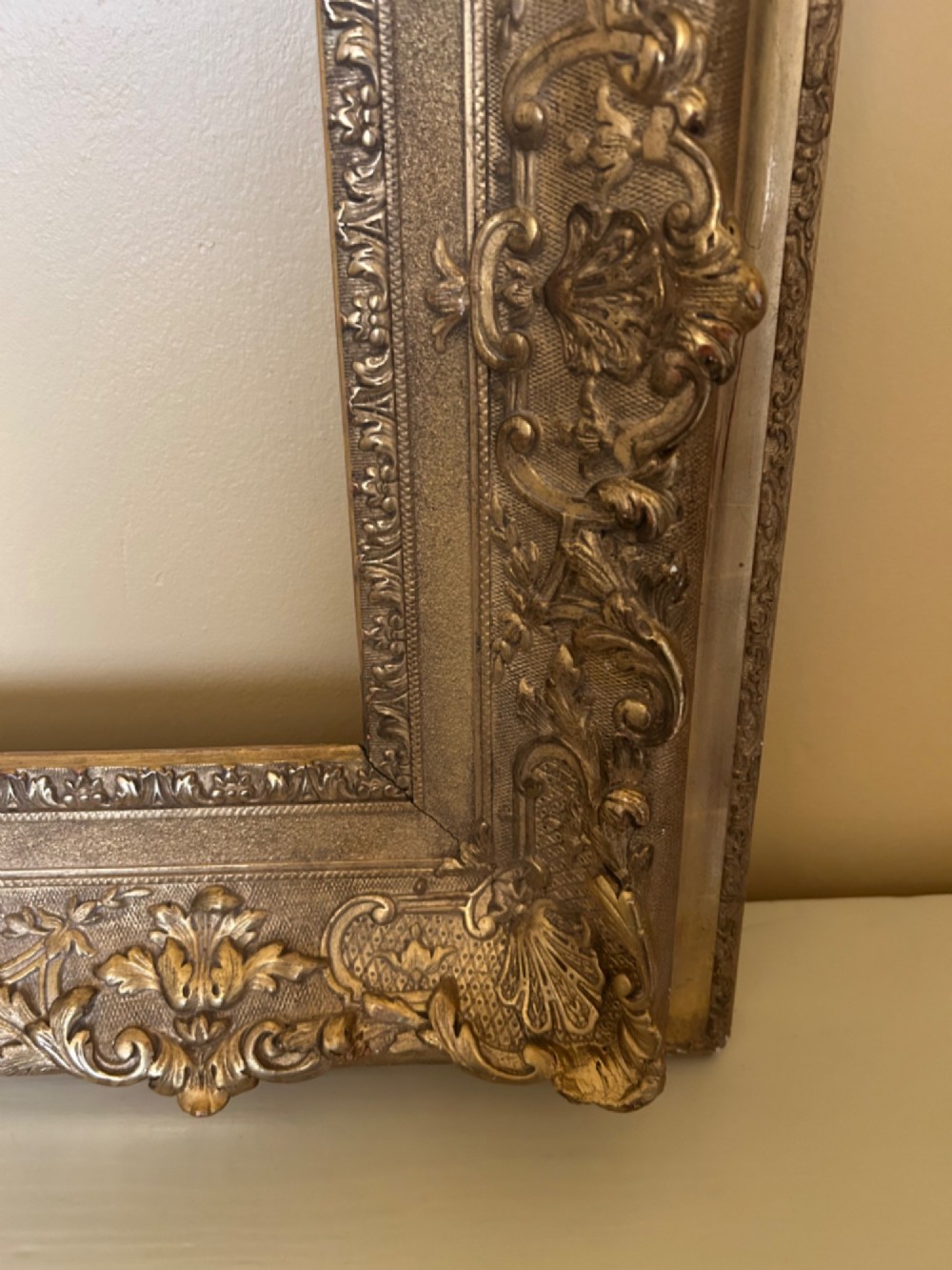 A rectangular 19th-century Rococo Revival style frame with intricate gilded floral, shell, and scrollwork gesso mouldings. View V