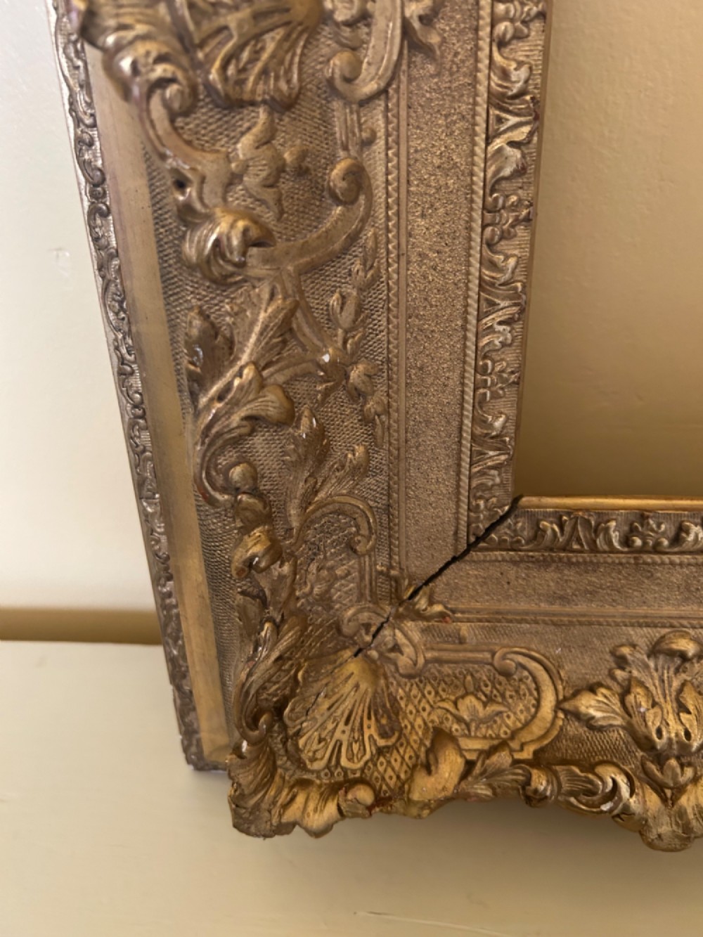 A rectangular 19th-century Rococo Revival style frame with intricate gilded floral, shell, and scrollwork gesso mouldings. View VI