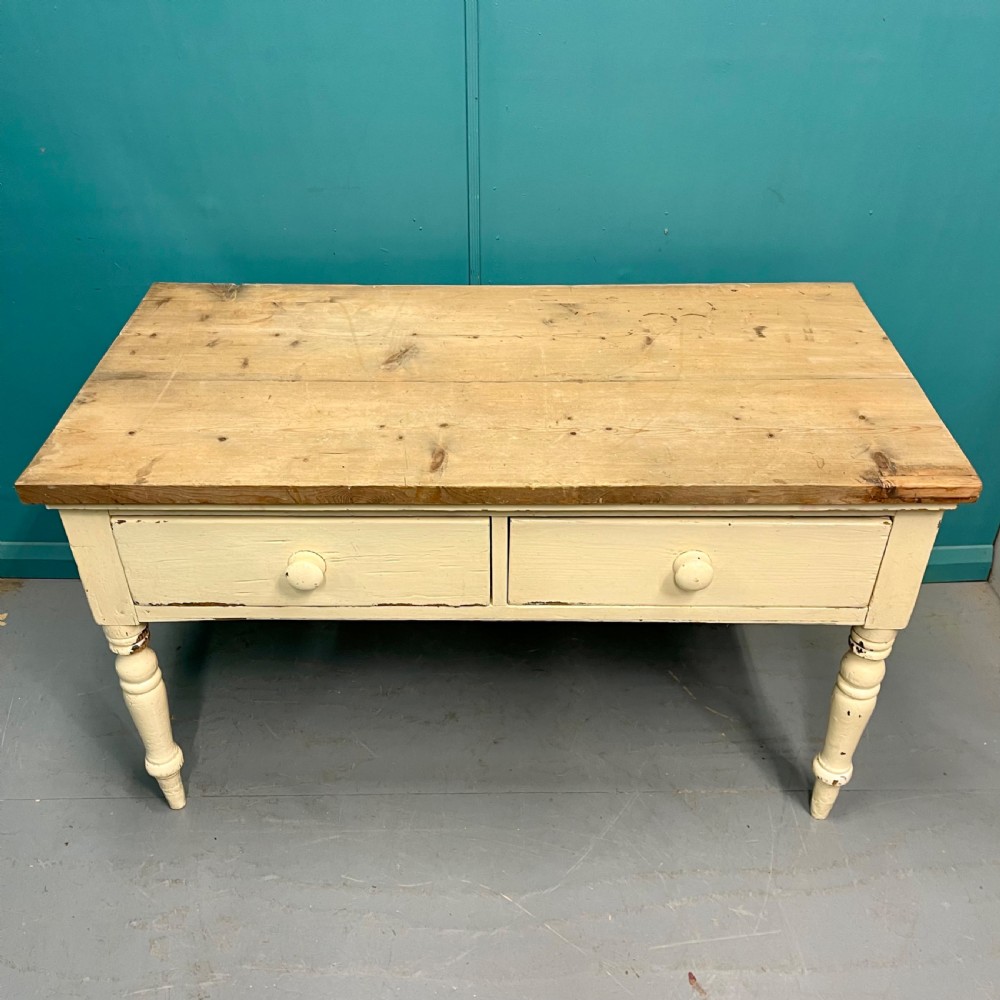 An antique pine server featuring a scrubbed rectangular wooden top, a cream-painted base, two drawers with round wooden knobs, and four turned legs. View IV