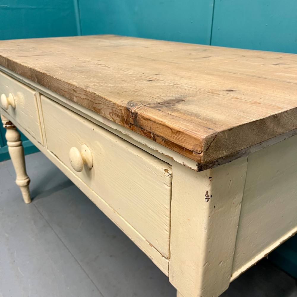 An antique pine server featuring a scrubbed rectangular wooden top, a cream-painted base, two drawers with round wooden knobs, and four turned legs. View V