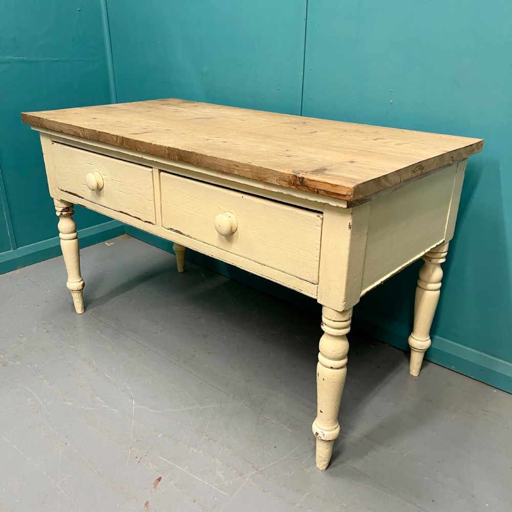 An antique pine server featuring a scrubbed rectangular wooden top, a cream-painted base, two drawers with round wooden knobs, and four turned legs. View VI