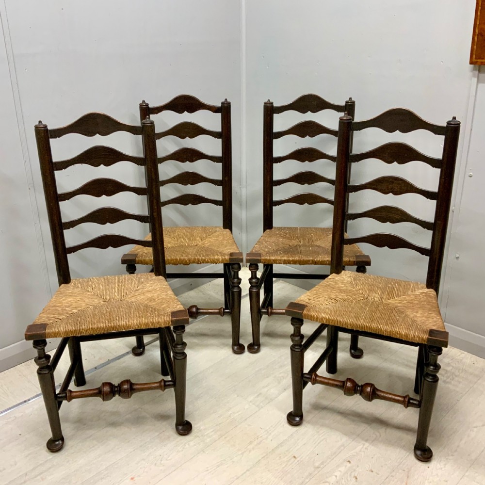 Set of 4 oak ladder back chairs