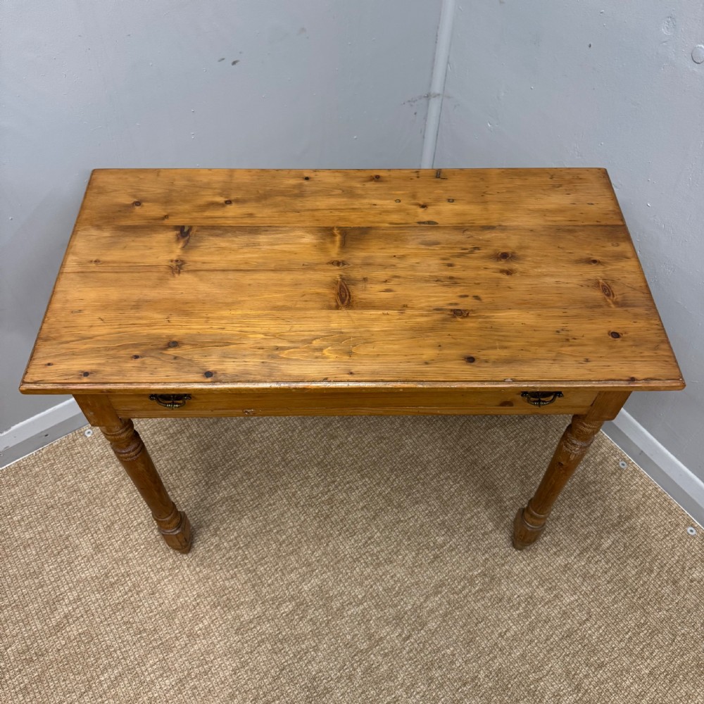 A 19th-century Victorian pine side table with turned legs and a single frieze drawer fitted with brass handles. View III