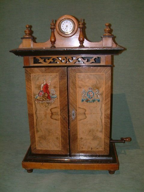 Edwardian Walnut Britania 9" Disc Music Box with Transfer Door Panels.