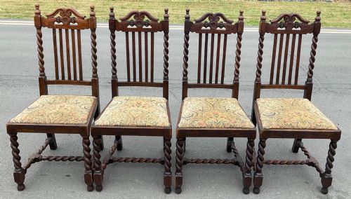 SET OF FOUR JACOBEAN STYLE OAK DINING CHAIRS