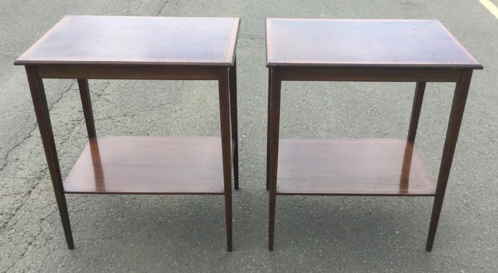 A pair of rectangular Edwardian mahogany occasional tables featuring fine line inlay, tapered legs, and lower tier shelves. View II