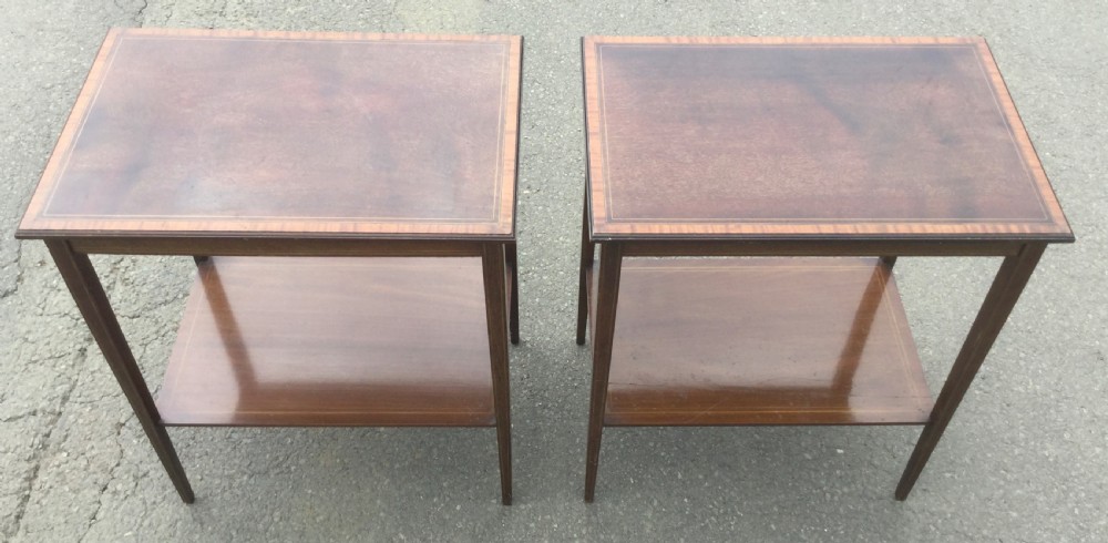 A pair of rectangular Edwardian mahogany occasional tables featuring fine line inlay, tapered legs, and lower tier shelves. View III