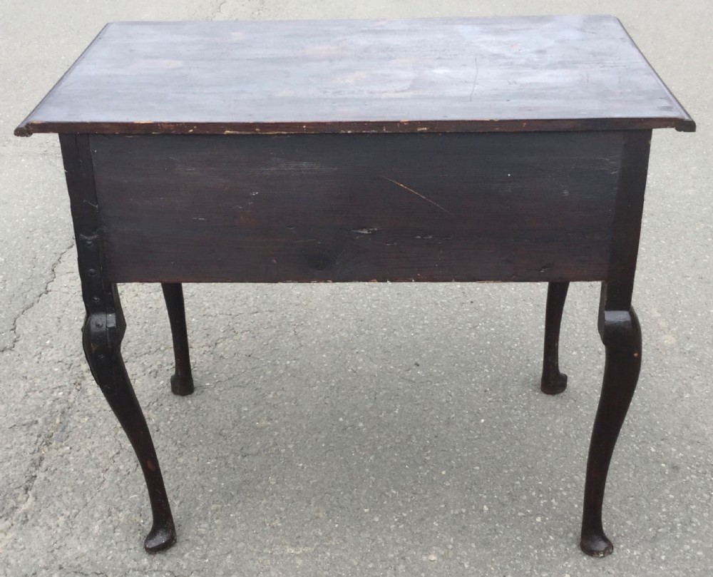 A Georgian dark oak side table featuring three front drawers with brass escutcheon plates, a shaped apron, and cabriole legs ending in pad feet. View XIII
