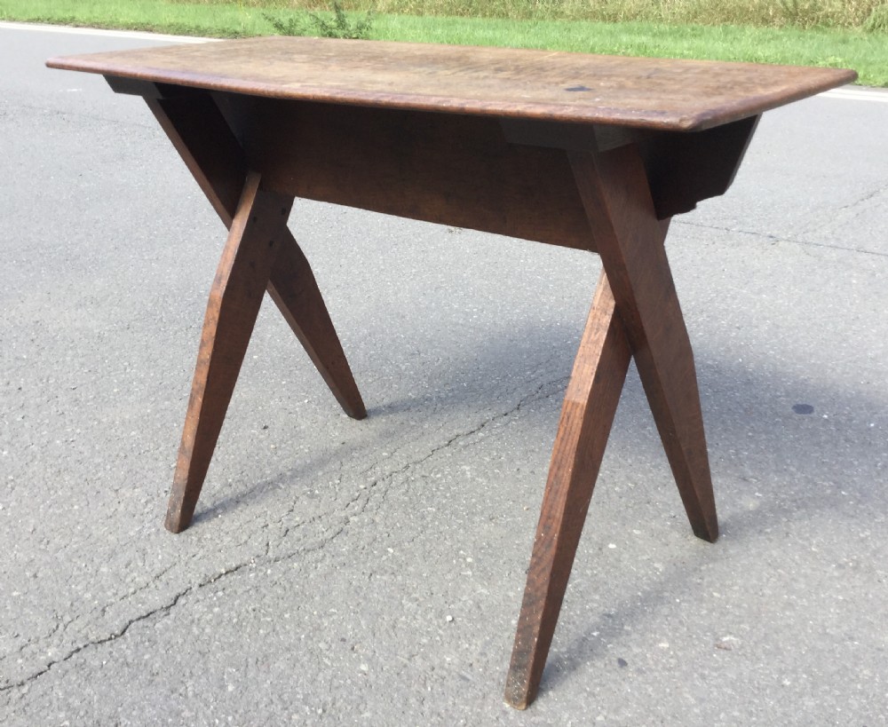 An Arts and Crafts style rectangular elm table featuring scissor-style cross base legs and visible natural timber grain. View II